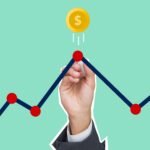 Cutout paper appliques of hand with chalk drawing graph under coin with dollar symbol on green background